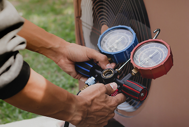technician checking operation air conditioner