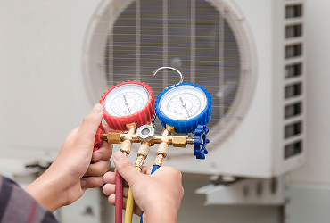 technician checking operation air conditioner