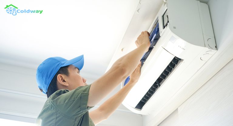 Repair-person-conducting-maintenance-on-an-air-conditioner-unit