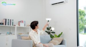 Asian-man-turning-on-air-conditioner
